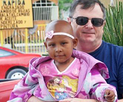 Juanita smiling with her family